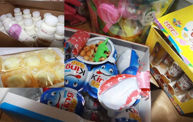Cận cảnh số bánh, kẹo, nước ngọt, sữa chua không nguồn gốc có ghi chữ Trung quốc trên bao bì. Ảnh: Tổng cục Quản lý thị trường