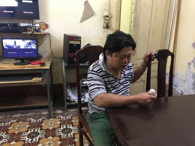 Hồ Vinh Minh Quang tại cơ quan công an.