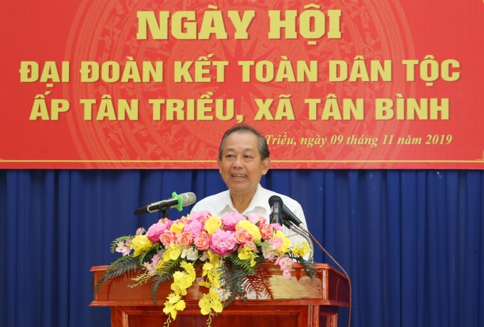 Phó Thủ tướng Thường trực Trương Hòa Bình phát biểu tại Ngày hội Đại đoàn kết toàn dân tộc tại ấp Tân Triều. Ảnh: VGP