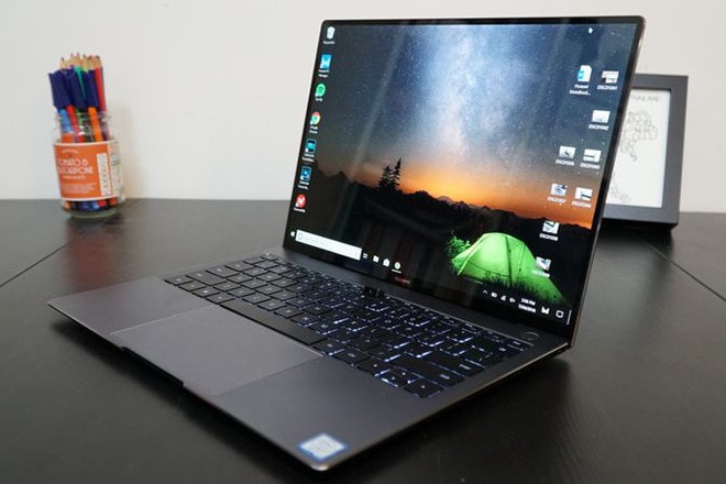 Máy tính MateBook đã được cấp phép chạy phần mềm từ Microsoft. Ảnh: AFP