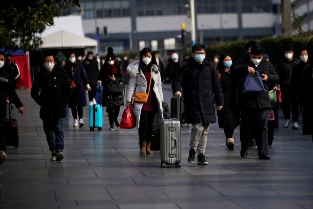 Người dân tại Bắc Kinh, Trung Quốc. Ảnh: Reuters