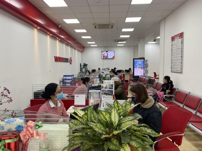 Các tổ chức tín dụng huy động vốn tăng là dấu hiệu khởi sắc. Ảnh: Dương Lâm