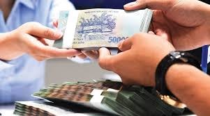 Miễn phí chuyển tiền cho các đối tượng nhận hỗ trợ thiệt hại do dịch COVID-19. Ảnh minh họa.