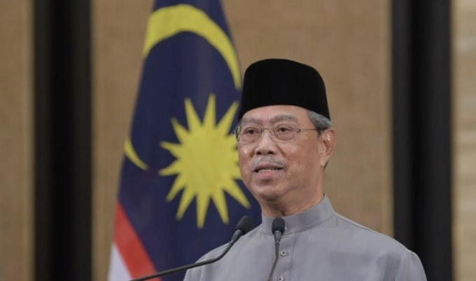 Thủ tướng Malaysia Muhyiddin Yassin cho biết sẽ cho phép mở cửa trở lại nền kinh tế từ ngày 4/5 - Ảnh: DPA
