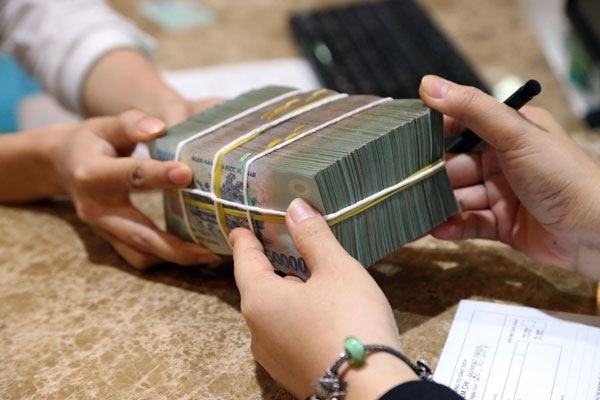 Miễn, giảm lãi và cho vay mới lãi suất thấp gần 1,9 triệu tỷ đồng để vượt Covid-19. Ảnh: TL