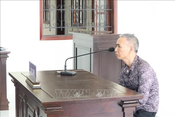 Đối tượng Trần Nhật Dân tại phiên tòa. Ảnh: TTXVN