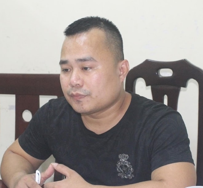 Đối tượng Trần Viết Trà làm việc với cơ quan công an. Ảnh: Công an Nghệ An