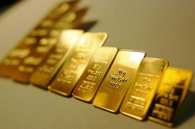 Giá vàng thế giới lần đầu tiên trong lịch sử leo lên ngưỡng 2.020 USD/ounce. Ảnh minh họa.