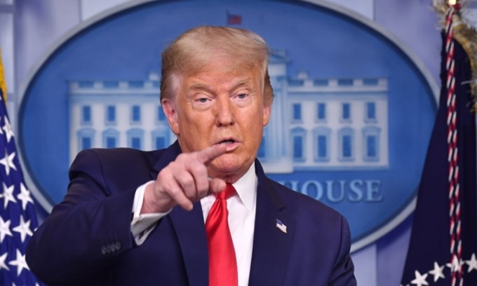Tổng thống Trump vừa ký thêm lệnh trừng phạt đối với TikTok - Ảnh: AFP