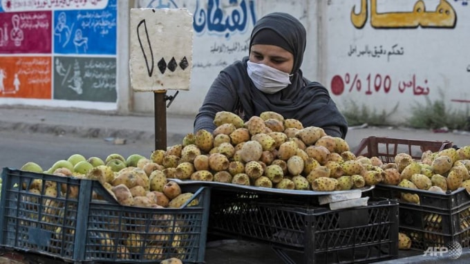 Một người bán hàng rong tại Syria. Ảnh: AFP