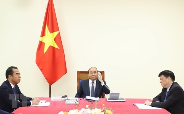 Thủ tướng Chính phủ Nguyễn Xuân Phúc điện đàm với Thủ tướng Đức Angela Merkel. Ảnh: TTXVN