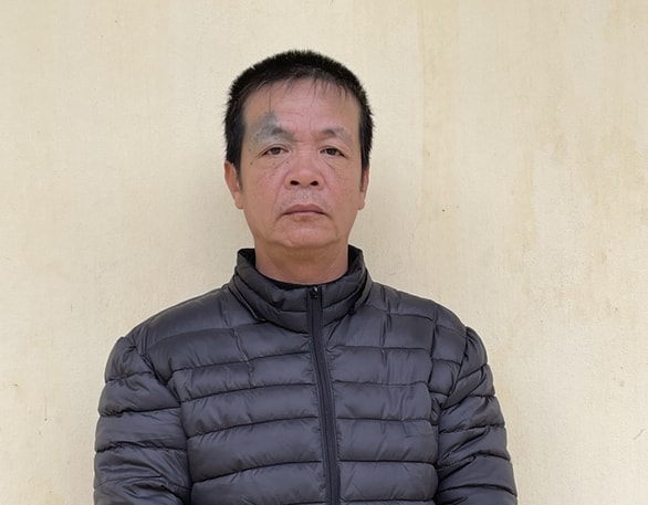 Đối tượng Nguyễn Đức Dũng bị bắt tại cơ quan công an. Ảnh: tuoitre.vn
