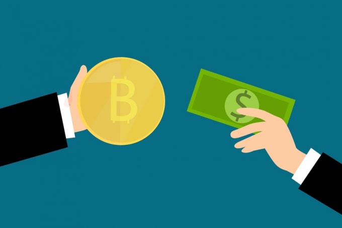 Bitcoin và tiền giấy đang cạnh tranh nhau để trở thành đồng tiền chính được lưu thông. Ảnh: Verdict