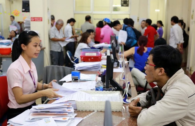 Doanh nghiệp làm việc với cơ quan thuế (Ảnh minh họa).
