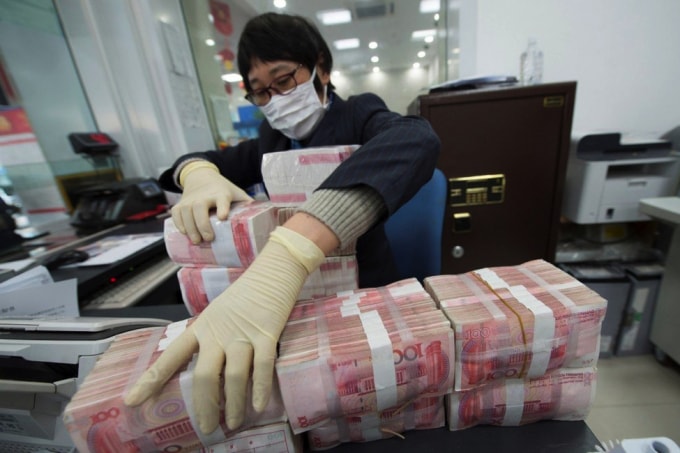 Nhân dân tệ của Trung Quốc đạt mức cao nhất trong 3 năm so với USD và mức cao nhất trong 5 năm so với rổ tiền tệ có trọng số thương mại trong tuần này. Ảnh: Reuters.
