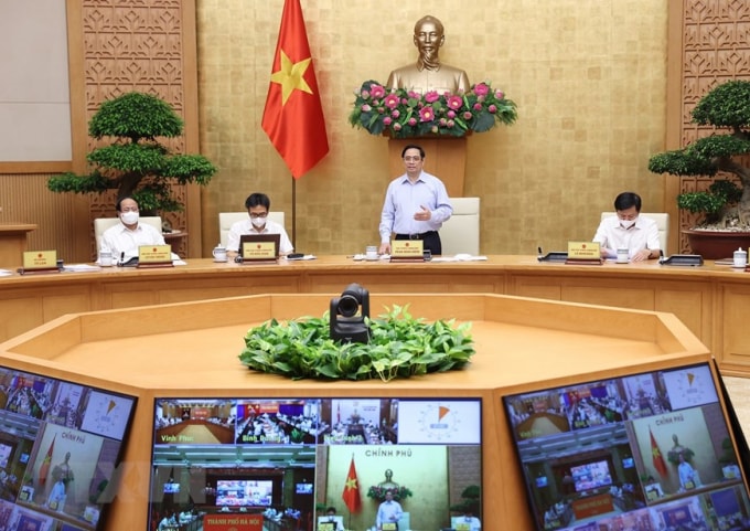 Thủ tướng Phạm Minh Chính chủ trì hội nghị triển khai Nghị quyết của Quốc hội về phòng, chống dịch. Ảnh: TTXVN