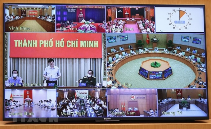 Cuộc họp trực tuyến từ điểm cầu Chính phủ đến các tỉnh, thành phố. Ảnh: TTXVN