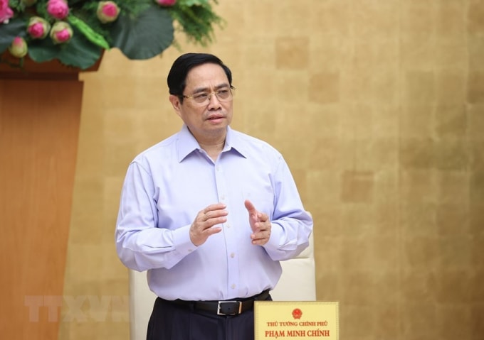 Thủ tướng Chính phủ Phạm Minh Chính đánh giá một số địa phương thực hiện quy định giãn cách xã hội theo Chỉ thị 15, Chỉ thị 16 còn “chập chờn”. Ảnh: TTXVN
