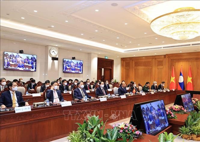 Chủ tịch nước Nguyễn Xuân Phúc và các thành viên Đoàn đại biểu Việt Nam tham dự buổi hội kiến. (Ảnh: TTXVN)
