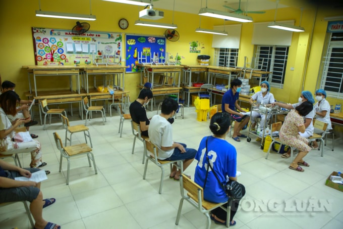 ha noi nhieu diem tiem chung da dat tren 98 so luong nguoi dan duoc tiem mui 1 hinh 2