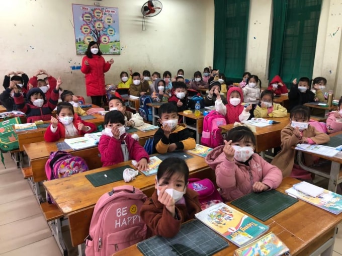hoc sinh tieu hoc ngoai thanh ha noi han hoan di hoc tro lai hinh 9