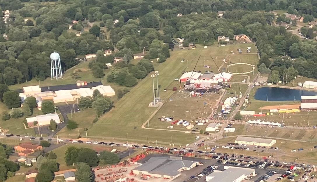 Close-up aerial view showing the Butler Farm Show Grounds (right) on the day of the rally with the building (left) that the shooter climbed on