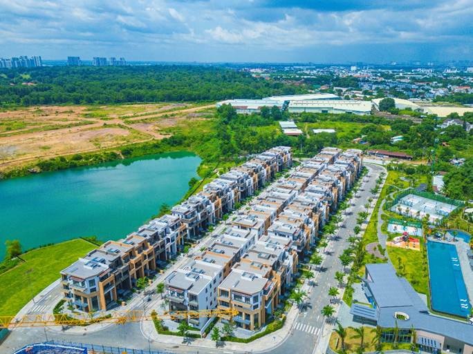 A group of buildings next to a body of water AI-generated content may be incorrect.