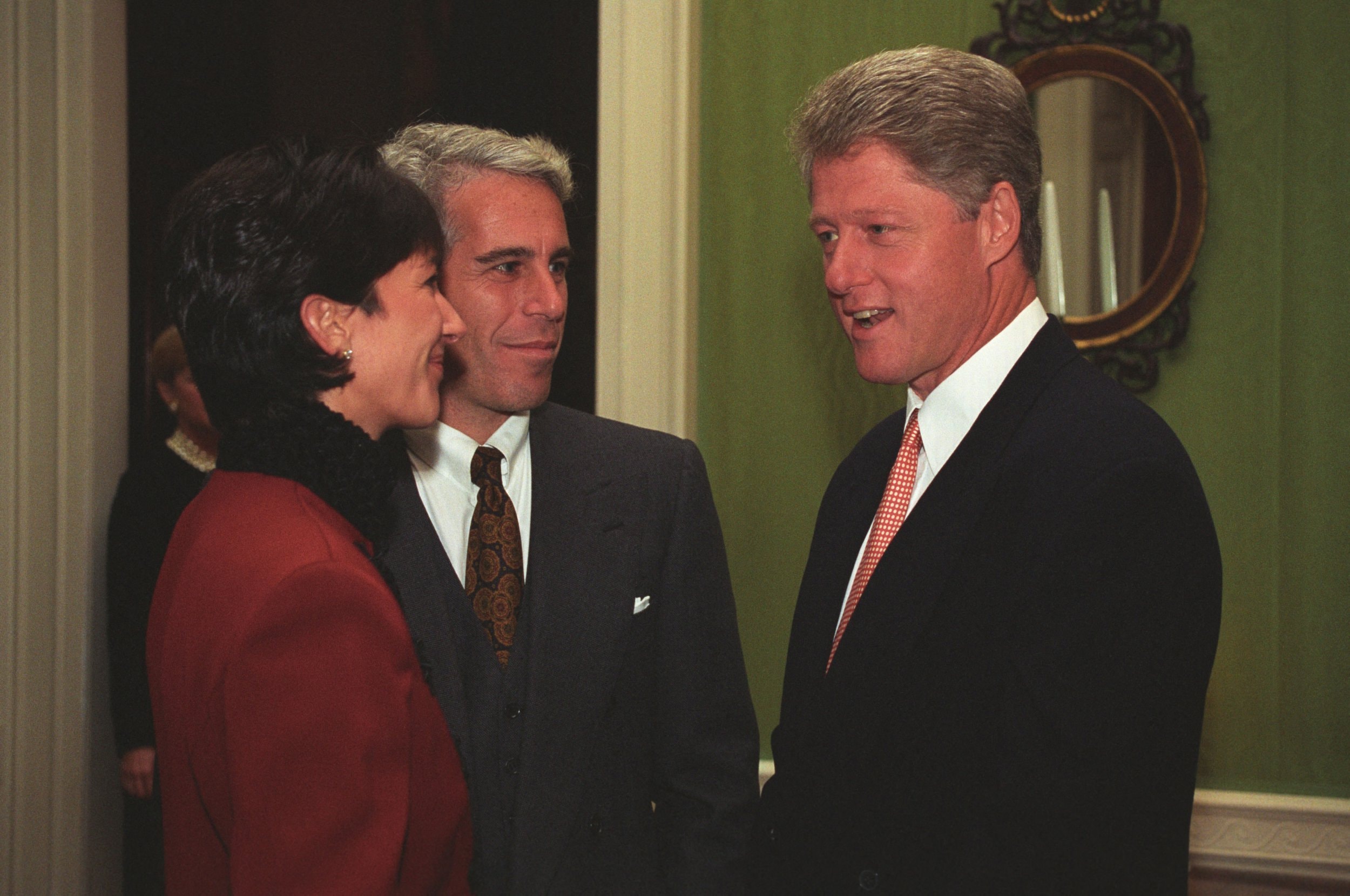 New photos of infamous sex offender Jeffrey Epstein and associate Ghislaine Maxwell at the Clinton White House, one day after Maxwell pleaded not guilty to sex-trafficking charges. The images, from the William J. Clinton Presidential Library, show Epstein and Maxwell speaking with then-President Bill Clinton at an event that took place in 1993 for donors to the White House Historical Association. The pictures corroborates a 2019 article from the Daily Beast, which reported that Epstein attended the event after donating $10,000 to the fund and visited the White House on other occasions in the early 1990s. Clinton has denied knowing anything about Epstein's crimes. In July 2019, Angel Urena, a spokesman for the former president, tweeted, 